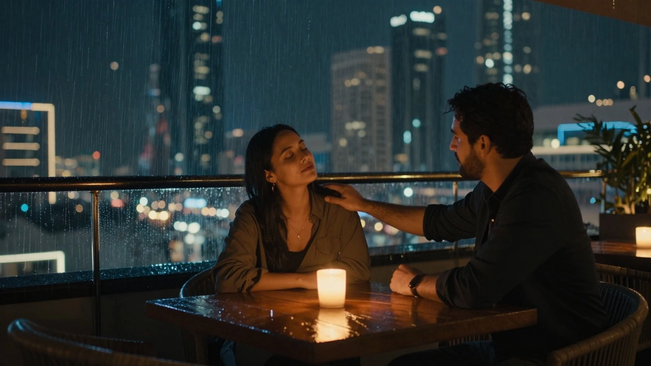 Two people in silent connection on a rainy Dubai rooftop, candlelight reflecting on wet surfaces.